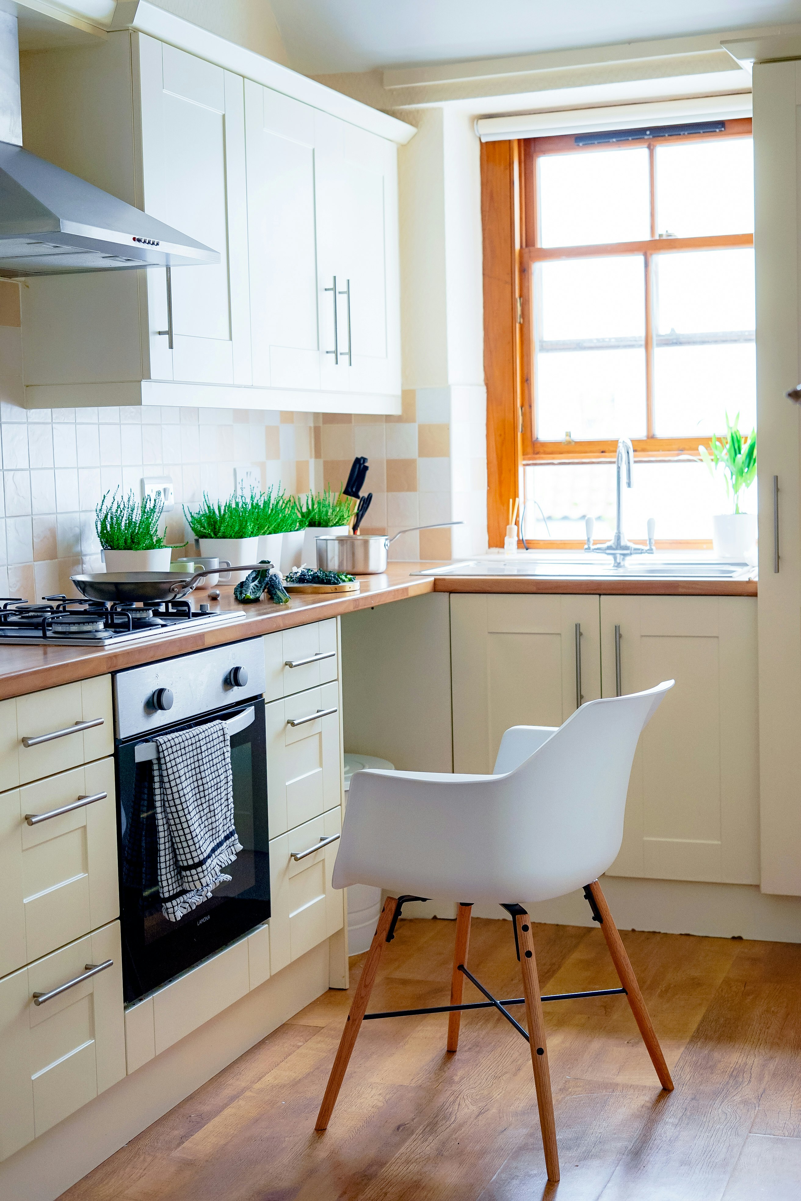 white chair near kitchen oven during daytime